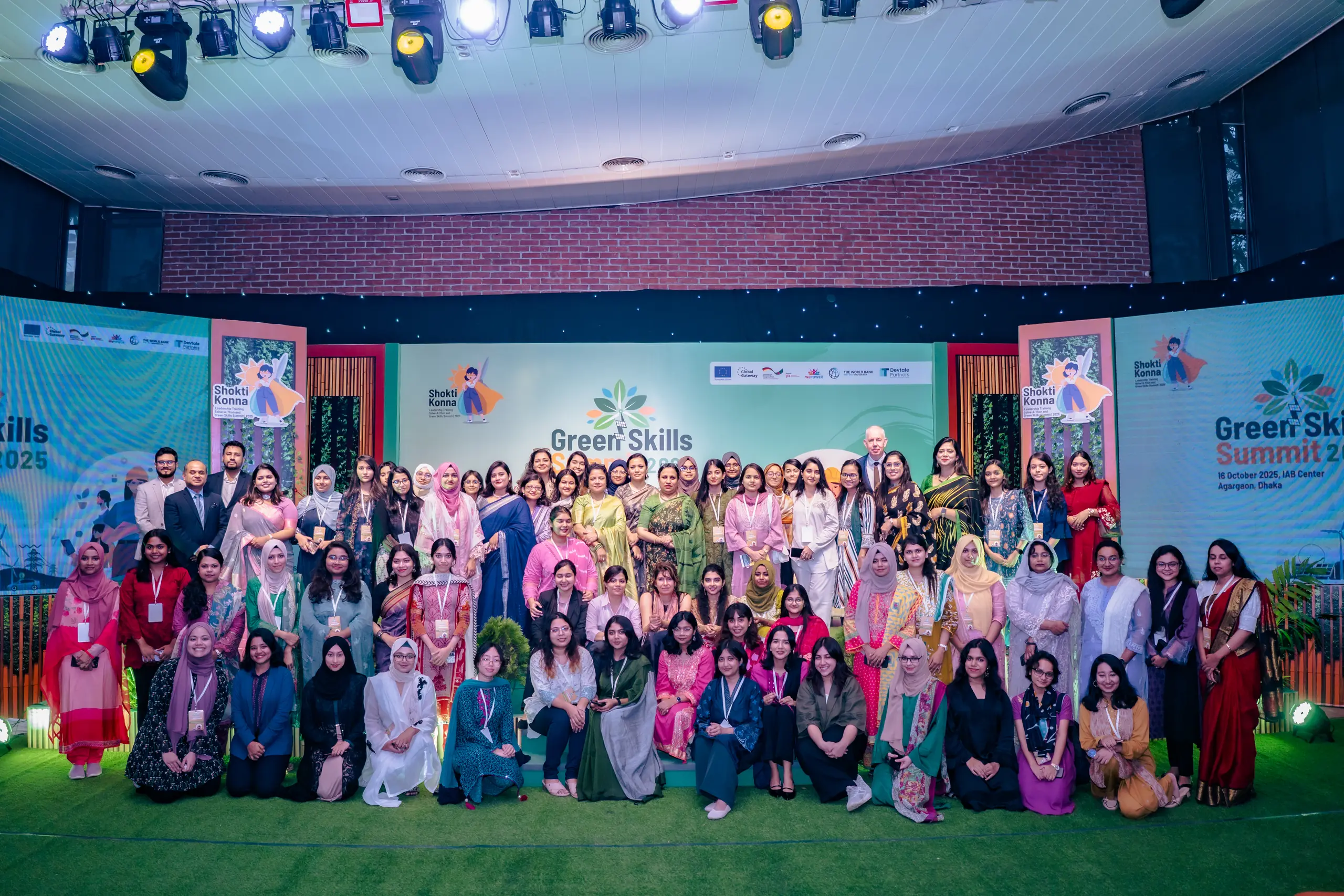 Shoktikonna participants and guests on stage at the Green Skills Summit 2025, IAB Center, Dhaka
