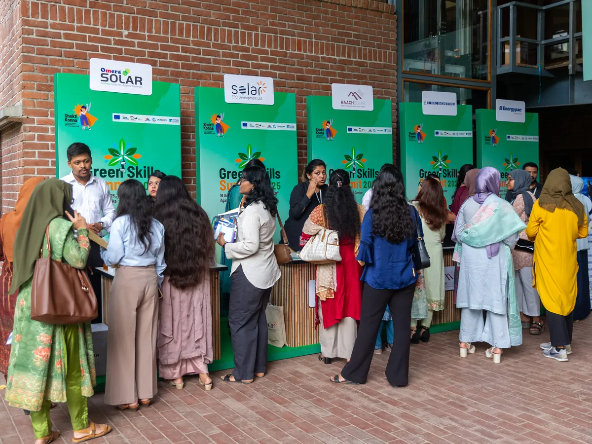 Participants talking to solar company recruiters at employer booths at the Green Skills Summit